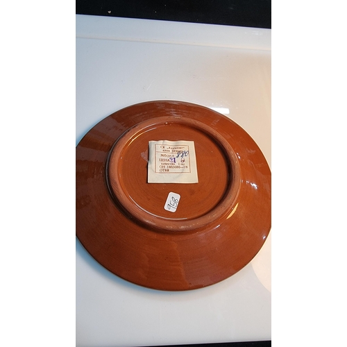 331 - Studio art glazed terracotta plate with a paper Russian label to the base. In good clean condition. ... 