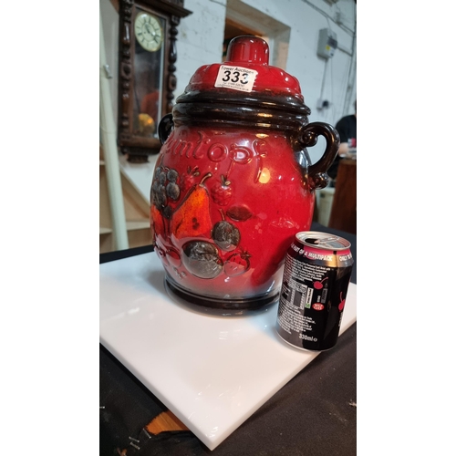 333 - Rumtopf large lidded jar with a red & black glaze. West German. Complete with original paper pamphle... 