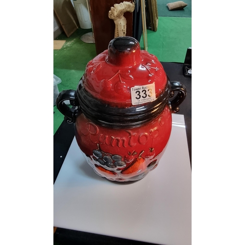 333 - Rumtopf large lidded jar with a red & black glaze. West German. Complete with original paper pamphle... 