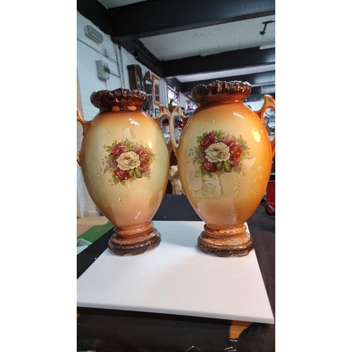 334 - Pair of vintage large urn vases with double sided scene.  One handle has an old repair otherwise in ... 