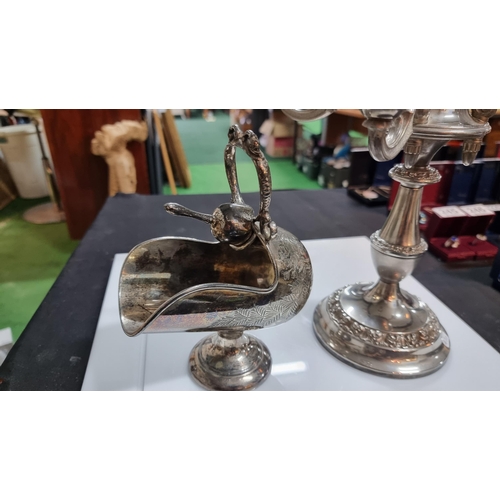 342 - Ornate silver plated candelabra and a silver plated sugar scuttle and original scoop. Candelabra mea... 