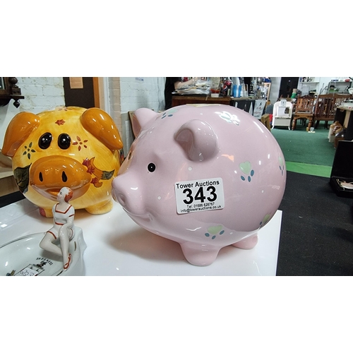 343 - Pair of large ceramic pig formed money banks with vintage Skeg Ness tourist ware ashtray. Largest pi... 