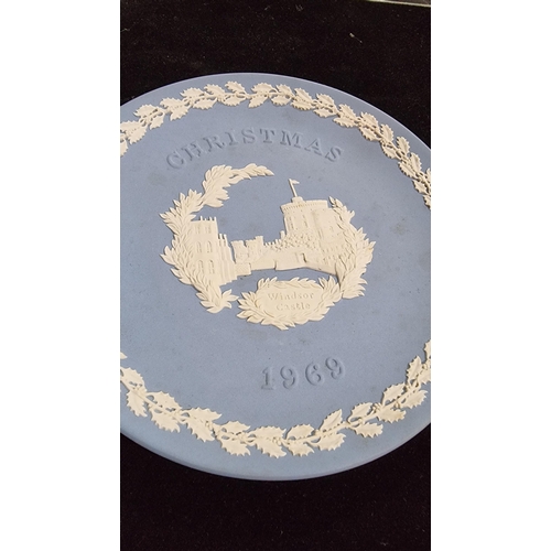 351 - Pair of Wedgwood blue Jasperware Christmas plates - Horse Guards 1978, Windsor Castle 1969.