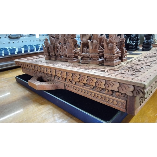 366 - Good quality Balinese Indonesian wooden hand carved deity chess set with intricately hand carved fig... 