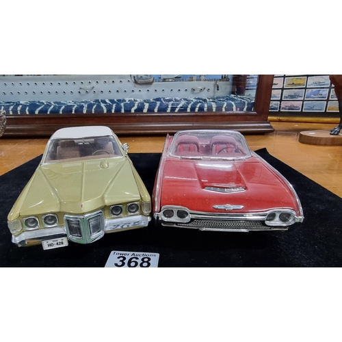 368 - Two large good quality diecast cars by ERTL Racing Champions of a Ford Thunderbird 1963 and Pontiac ... 