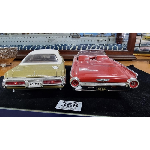 368 - Two large good quality diecast cars by ERTL Racing Champions of a Ford Thunderbird 1963 and Pontiac ... 