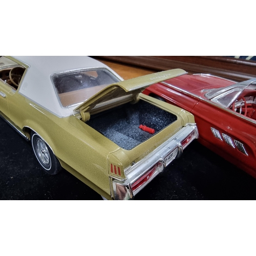 368 - Two large good quality diecast cars by ERTL Racing Champions of a Ford Thunderbird 1963 and Pontiac ... 