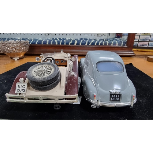 369 - Two large model diecast cars one of Mercedes Benz SSK by Burago the other is Peugeot 203 - 1954 by S... 