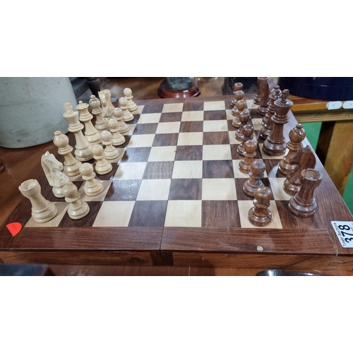 378 - Good large wooden chess board with large wooden carved chess pieces. Folds up for storage. In excell... 