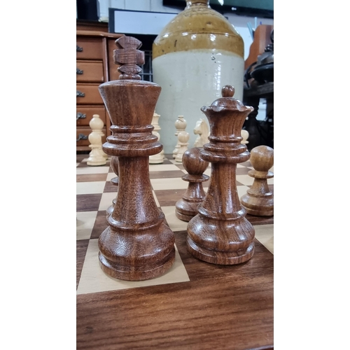 378 - Good large wooden chess board with large wooden carved chess pieces. Folds up for storage. In excell... 