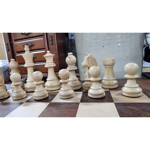 378 - Good large wooden chess board with large wooden carved chess pieces. Folds up for storage. In excell... 