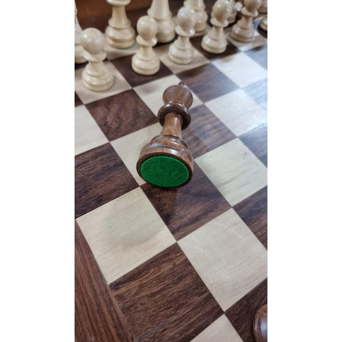 378 - Good large wooden chess board with large wooden carved chess pieces. Folds up for storage. In excell... 