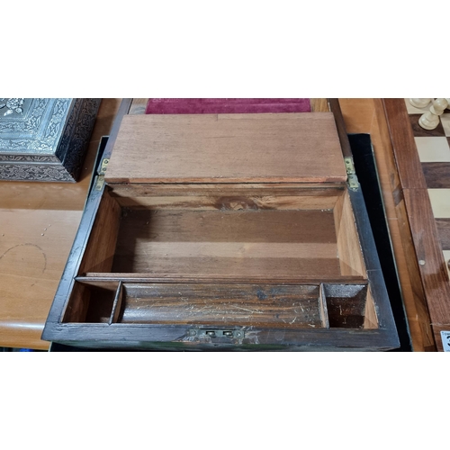 381 - Antique rosewood writing slope with a purple velvet interior, in good condition. Measures height 15c... 