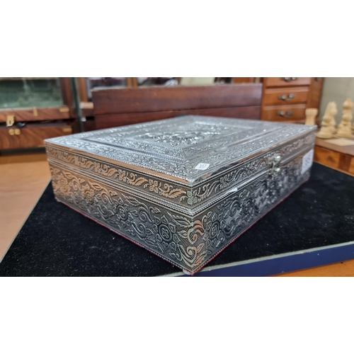 385 - Pretty ornate embossed silvered jewellery box with a flower design to the top revealing a fitted fel... 