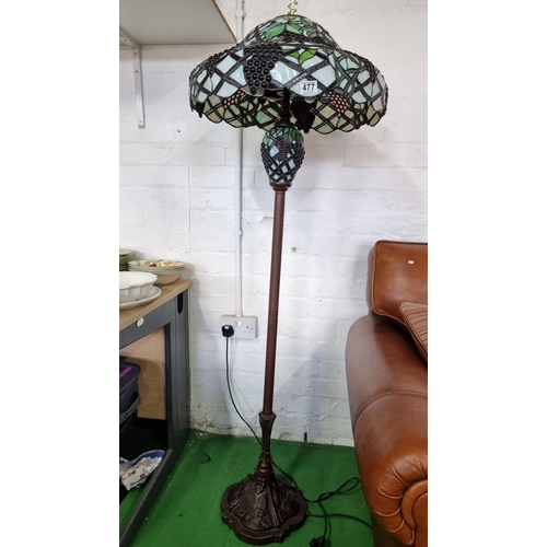 477 - Large impressive tiffany style standard lamp with a very large stained glass shade in grape & foliag... 