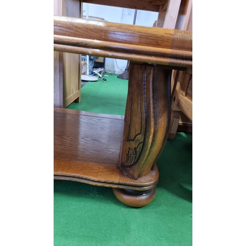 490 - Chunky solid oak coffee table with ornate carved legs. Measures 47cm height, 124cm length, 64cm dept... 