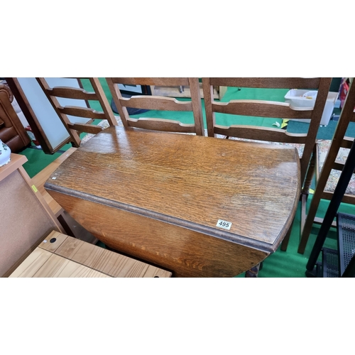 495 - Vintage solid oak gateleg table with carved barley twist legs. In excellent clean condition with a c... 