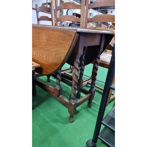 495 - Vintage solid oak gateleg table with carved barley twist legs. In excellent clean condition with a c... 