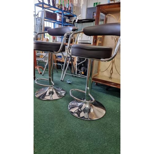 505 - Pair of leather look & chrome gas powered bar stools. Never been used came straight out of a house i... 