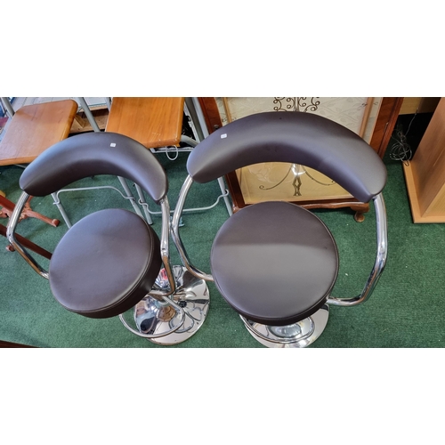 505 - Pair of leather look & chrome gas powered bar stools. Never been used came straight out of a house i... 