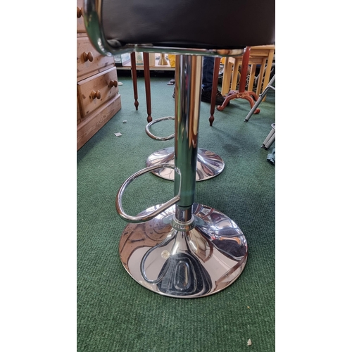 505 - Pair of leather look & chrome gas powered bar stools. Never been used came straight out of a house i... 