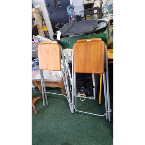 507 - Pair of wood & metal folding bar stools. Measures 88cm height, 49cm width.