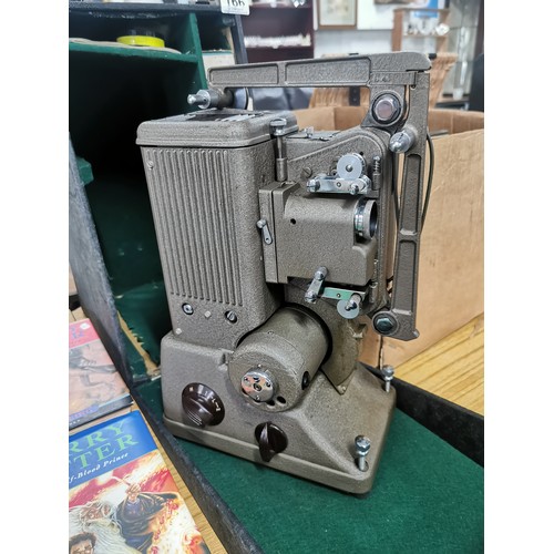 166 - Boxed Specto 500 projector with a large quantity of vintage film reels. comes with boxed bulbs, orig... 