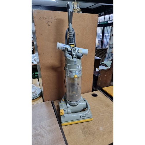 6 - Dyson DC04 vacuum cleaner in working condition complete with some accessories