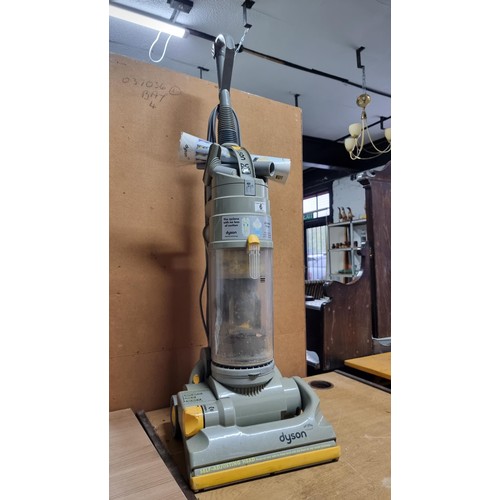 6 - Dyson DC04 vacuum cleaner in working condition complete with some accessories