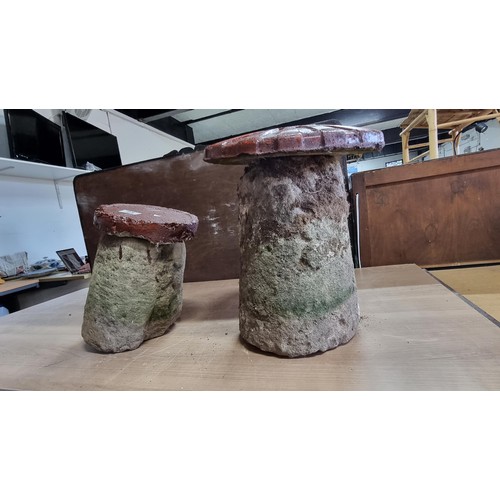 21 - 2x vintage saddle stone bases one with a cast bin lid style top, tallest measures 37cm high diameter... 