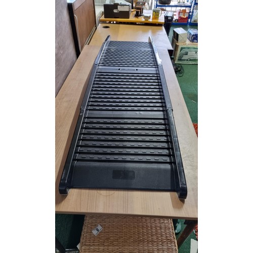 23 - Folding plastic ramp for pets to get into the vehicle. in good order