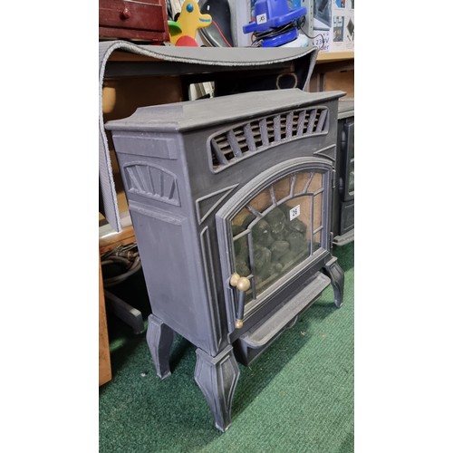 26 - Good quality metal gas powered heater in the form of a multi stove, in good condition, height of 63c... 