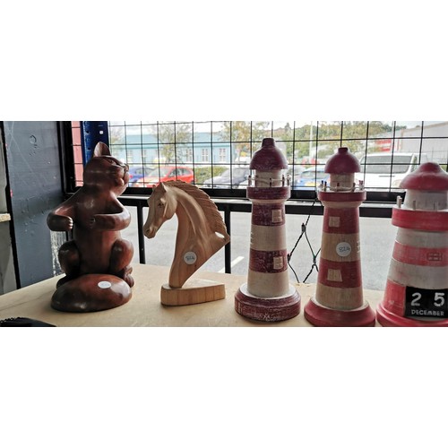 94 - Mixed lot of hand carved hand painted wooden figures inc 4x light houses, horse bust and cat formed ... 