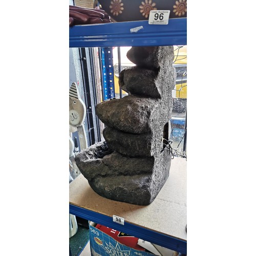 98 - Natural look stacked rocks garden water feature. Measures 53cm height.