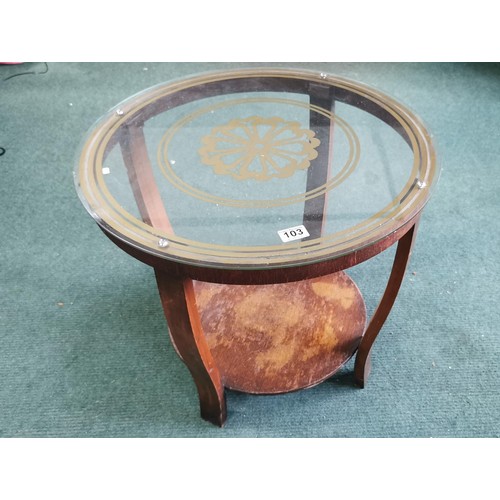 103 - Vintage art deco glass topped circular coffee table with an attractive gold design painted on the gl... 