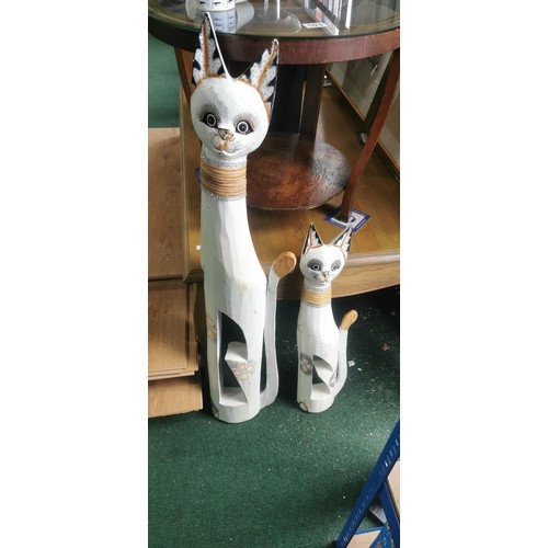 106 - Quantity of 4x tall hand carved and hand painted white cat figures. Largest measures 104cm height.