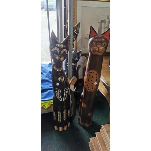 107 - Quantity of 4x tall hand carved and hand painted cat figures. Largest measures 82cm height.