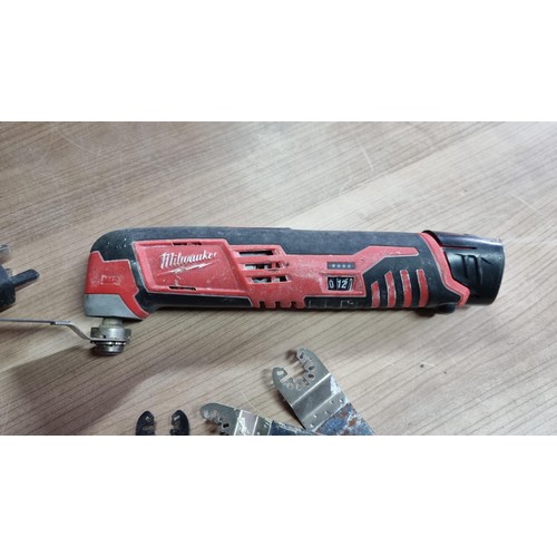 55 - Bagged Milwaukee C12MT cordless multi tool complete with charger and battery