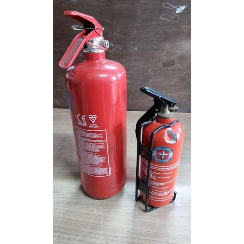 57 - 2x fire extinguishers both appear to be full (we can't be held responsible for full functionality of... 