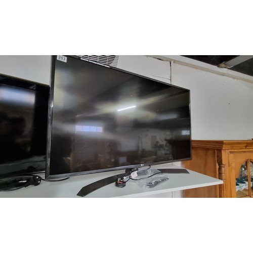 253 - LG 42in 4k flat screen TV model number 43ujv64v in excellent working condition with control