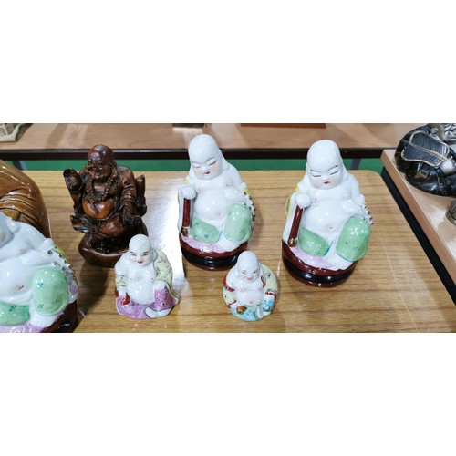 189 - Quantity of 7x laughing Buddha (6x ceramic and 1x resin) highly detailed, largest measures 18cm heig... 