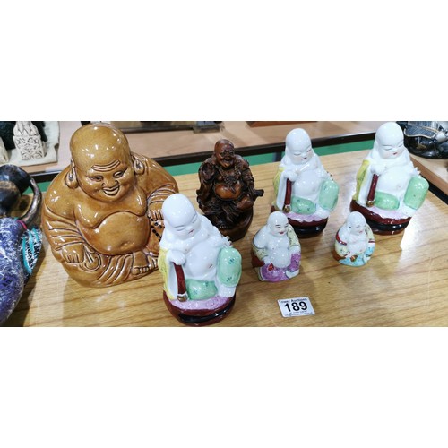 189 - Quantity of 7x laughing Buddha (6x ceramic and 1x resin) highly detailed, largest measures 18cm heig... 