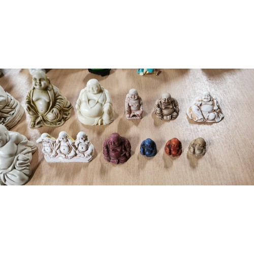 195 - 15x laughing Buddha figures in plaster and resin with intricate designs. Largest measures 12cm heigh... 