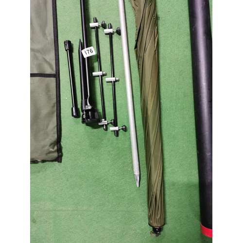 176 - Brand new fishing rod rest and fishing brolly complete in bag and plastic tube