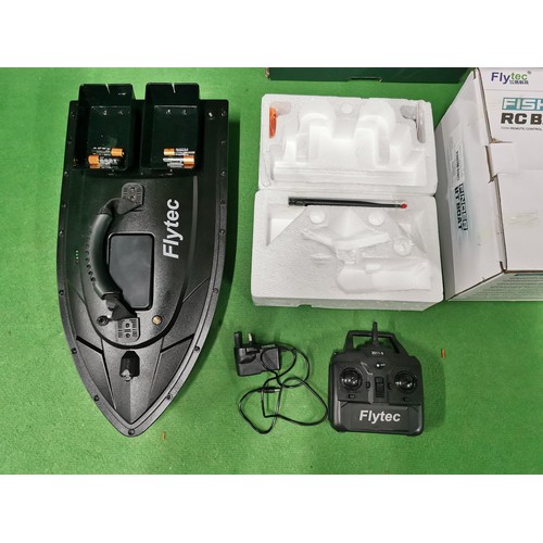 183 - flyTech fish finder remote controlled bait boat in as new condition, complete in box with all necess... 