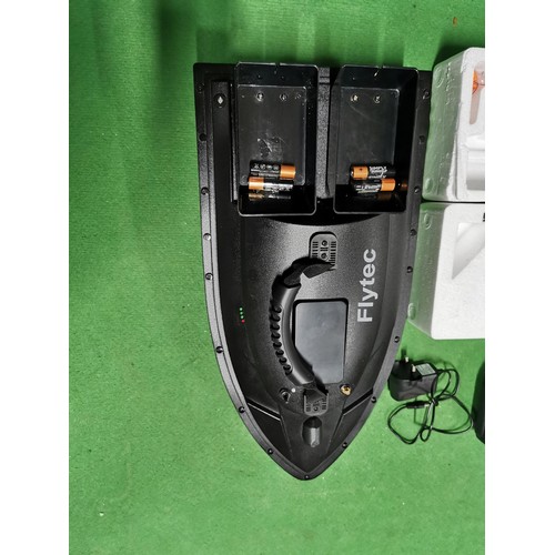 183 - flyTech fish finder remote controlled bait boat in as new condition, complete in box with all necess... 