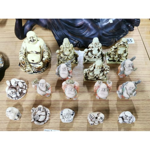 186 - 16x quantity of small resin laughing buddha figures in ivory and cream colours. Height of tallest fi... 