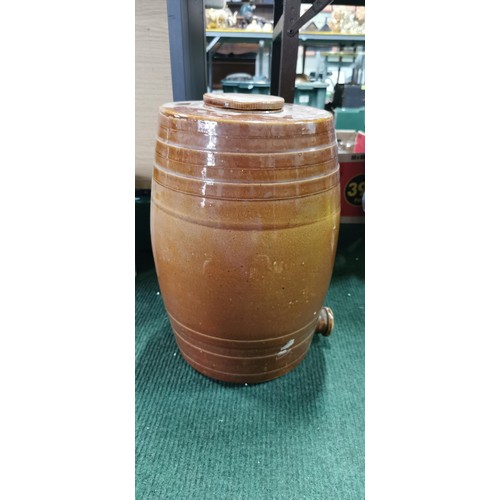 222 - Large treacle glazed stoneware cast barrel complete with lid. Measures 44cm height x 30cm diameter