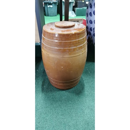 222 - Large treacle glazed stoneware cast barrel complete with lid. Measures 44cm height x 30cm diameter