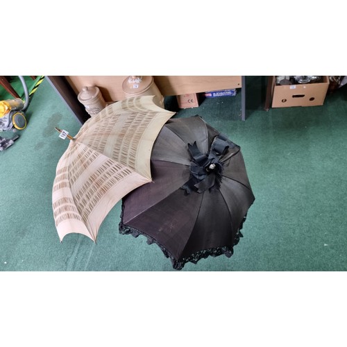 487 - 2x victorian parasols inc a black silk and lace parasol. The black parasol has a briar wood handle, ... 